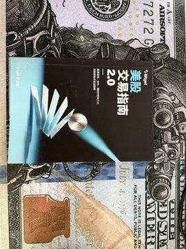 A blue 2.0mm Pentel mechanical pencil box rests on top of a U.S. one-dollar bill, with Japanese text reading "油性ボールペン 2.0" visible on the packaging.