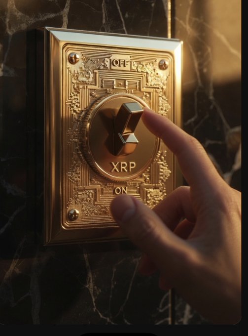 A hand flipping a gold ornate toggle switch labeled 'XRP' from OFF to ON position, mounted on dark marble.