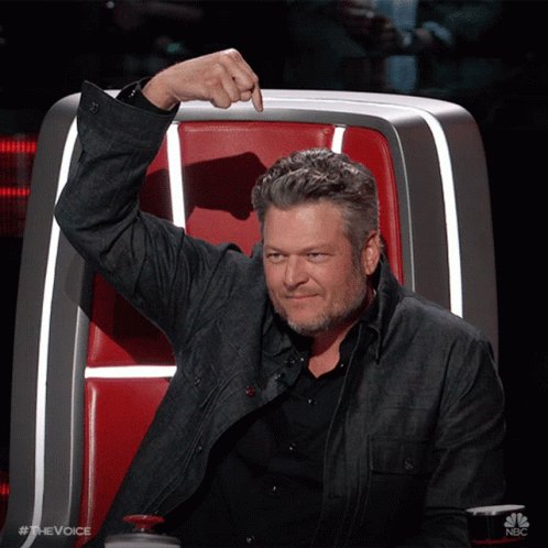 The image features a man sitting in a chair while raising his hand up high. He appears to be making a gesture or pointing at something, possibly related to the content being discussed on the Voice Show. The caption of the image reads "Lots of good options out there, but only one network that keeps control of that information solely with YOU". This suggests that the man is expressing his opinion about the current state of television news and its influence on people's lives.