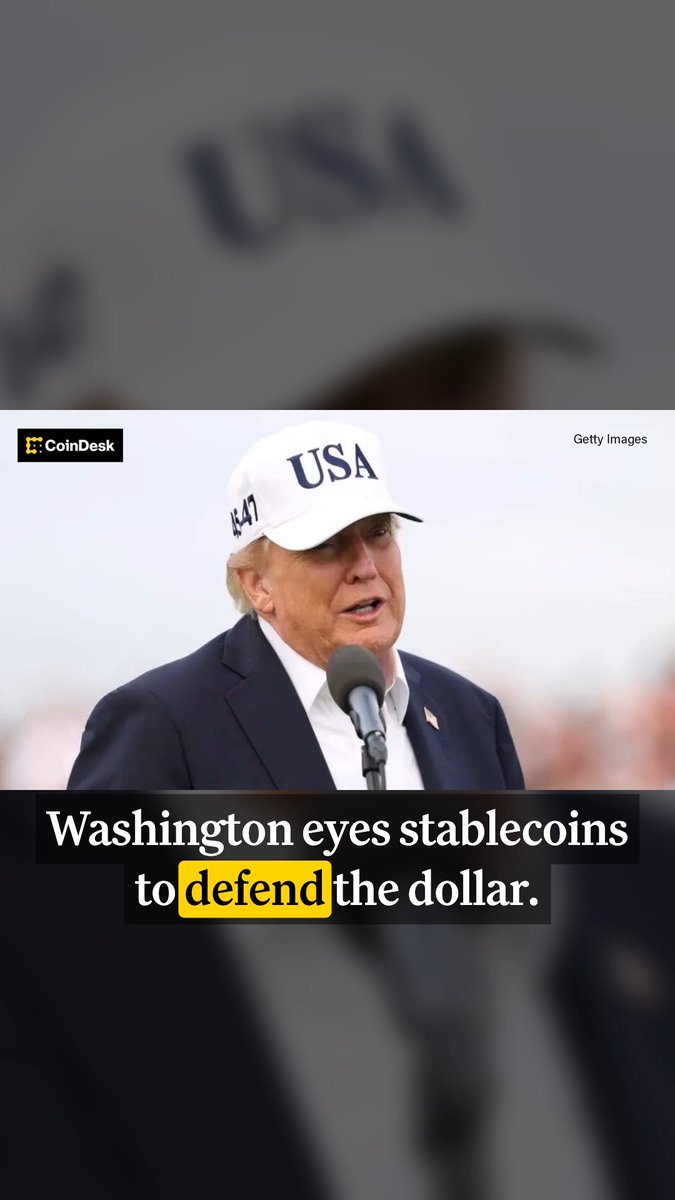 President Trump, wearing a white "USA" and "47" cap, speaks at a podium beneath a CoinDesk headline reading "Washington eyes stablecoins to defend the dollar," visually anchoring the post's theme of U.S. policymakers leveraging stablecoin regulation to reinforce the dollar's global position amid rising Treasury yields.