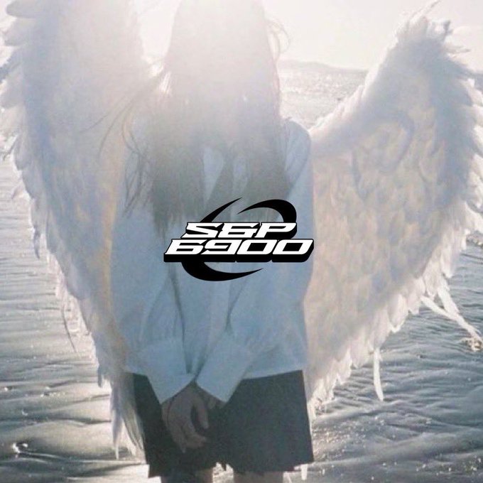 A figure with large white angel wings stands on a beach, with the 'S&P 6900' logo prominently displayed in the center over a faded, sunlit image.