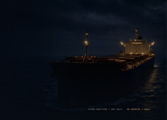 A large dry bulk carrier named ETHRA MARITIME sails through dark waters at night, illuminated by its deck lights, with text indicating it has been in service since 2021.