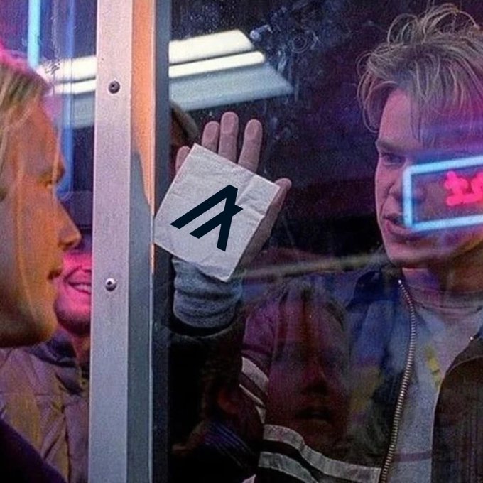 A man behind a glass window presses a crumpled napkin bearing the "A" Algorand logo against the pane, with reflections of others visible around him, symbolizing the post's message about Algorand being an underrated L1 blockchain.