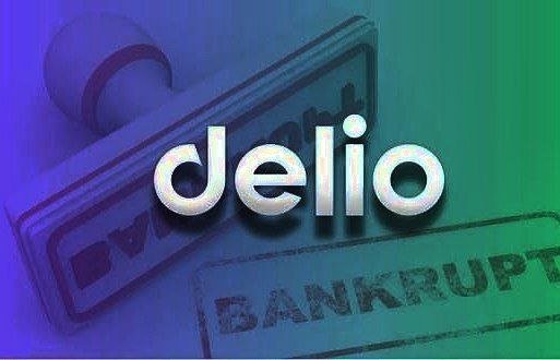 A logo graphic displaying the word 'delio' in white text overlaid on a background showing a stamp and the word 'BANKRUPT', with a purple-to-green color gradient.