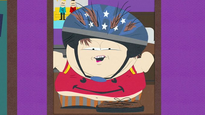A cartoon character from South Park wearing a stars-and-stripes helmet, red tank top, and a sweatband, standing in a doorway with an exaggerated facial expression.