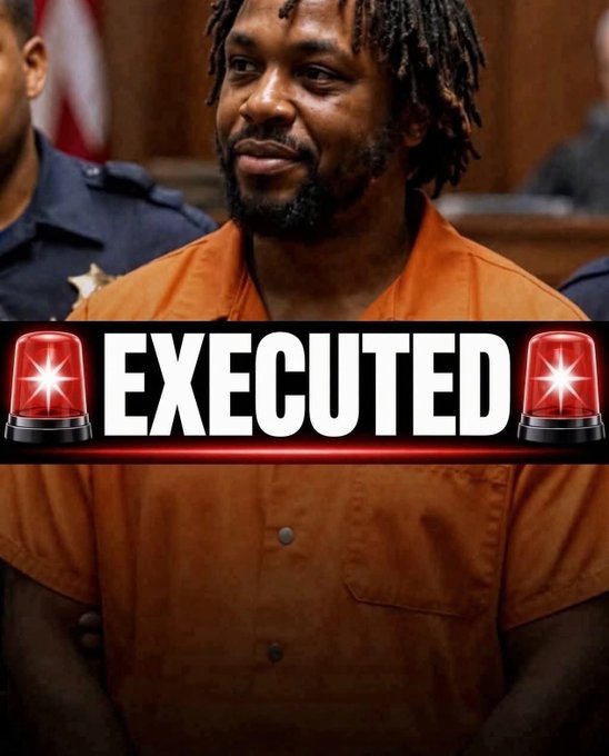 A man with dreadlocks wearing an orange jail jumpsuit smiles slightly in a courtroom, overlaid with the word 'EXECUTED' flanked by police siren emojis.