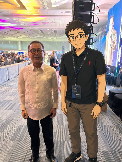 The image features a man wearing glasses standing next to another person, both of them posing for a picture. The man with glasses appears to be dressed in a suit, while the other person has a lanyard around their neck. They are positioned on a stage or a similar setting, which suggests that they might be attending an event or gathering.

The post caption reads: "It is just day 1 Keep eyes on $GITLAWB". This phrase seems to be related to the image and could possibly be a reference to a popular video game series called "$GITLAWB" or a recent news article about a court case involving a character named GITLAW.