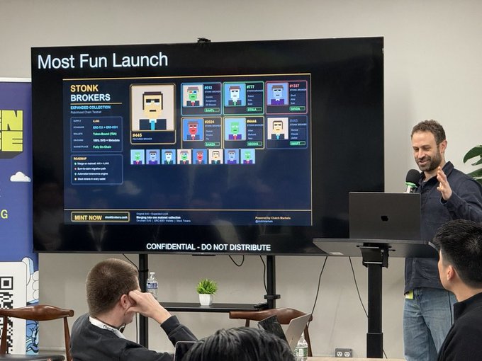 A man presents the "Most Fun Launch" of Stonk Brokers, an expanded collection featuring pixelated NFT characters (including Clutch, Clone, DB4X, ESG, FBA, GMEDIA, and Jefferies) on Robinhood Chain, while attendees watch from below. The presentation aligns with the post's announcement of a free mint opportunity for Stonk Brokers on Robinhood's mainnet, where burning a Pup Cup or Clutch Puppies NFT secures a whitelist slot.