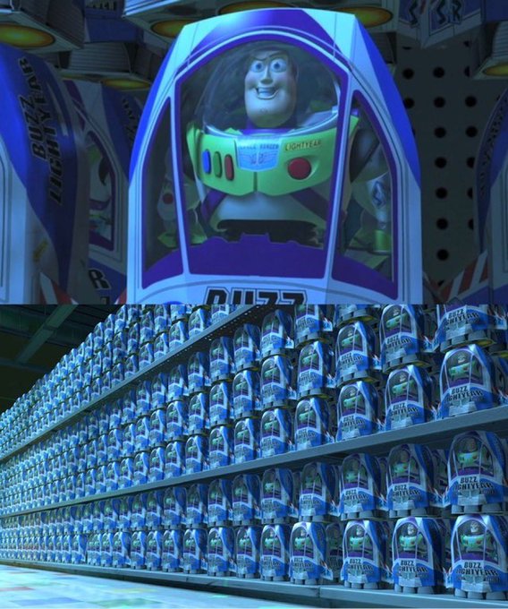 A retail display features massive stacks of Buzz Lightyear toy packaging from Pixar's Toy Story, with a large promotional banner above showing the character in his space suit.