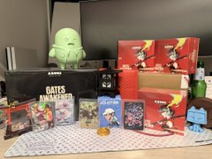 A collection of 'Bats N' Wands' branded merchandise and card game products arranged on a table, including red boxes, cards, and figurines.