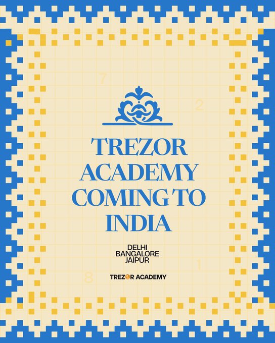 A promotional graphic with a blue and yellow pixelated border announces 'TREZOR ACADEMY COMING TO INDIA' in Delhi, Bangalore, and Jaipur.