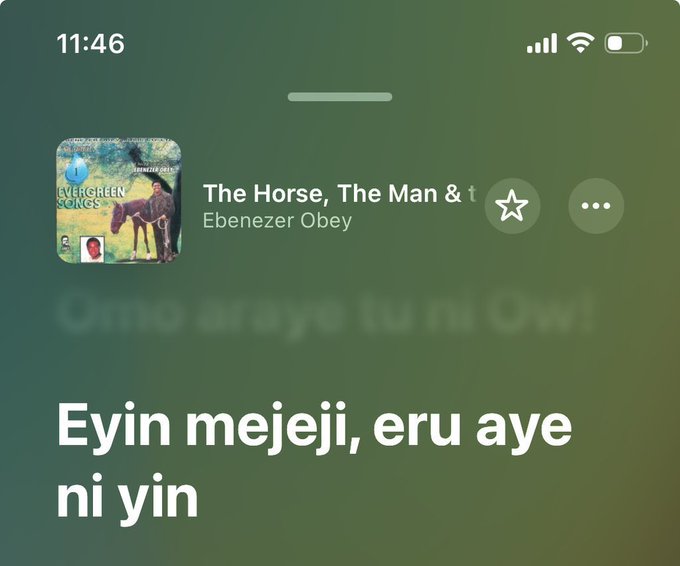 A screenshot of a phone showing a music player playing 'The Horse, The Man &...' by Ebenezer Obey with lyrics 'Eyin mejeji, eru aye ni yin' displayed.