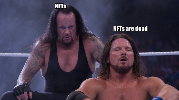 A WWE scene shows The Undertaker looming menacingly behind AJ Styles, with text labeling Undertaker as "NFTs" and Styles as "NFTs are dead," humorously illustrating the post's joke about NFTs repeatedly being declared dead yet persistently sticking around.
