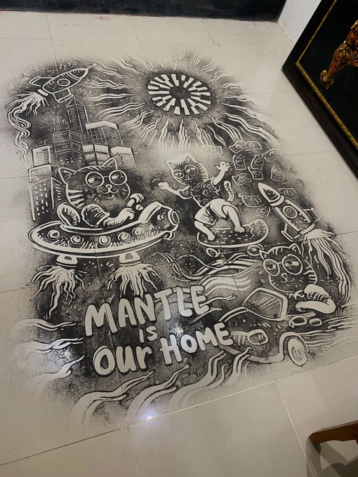 A detailed black-and-white chalk drawing on a tiled floor depicts whimsical cats riding UFOs and rockets amid cityscapes and a radiant sun, with the hand-lettered phrase "Mantle is Our Home" prominently displayed, visually reinforcing the post's theme of the Mantle ecosystem's expanding role in tokenization and institutional adoption.
