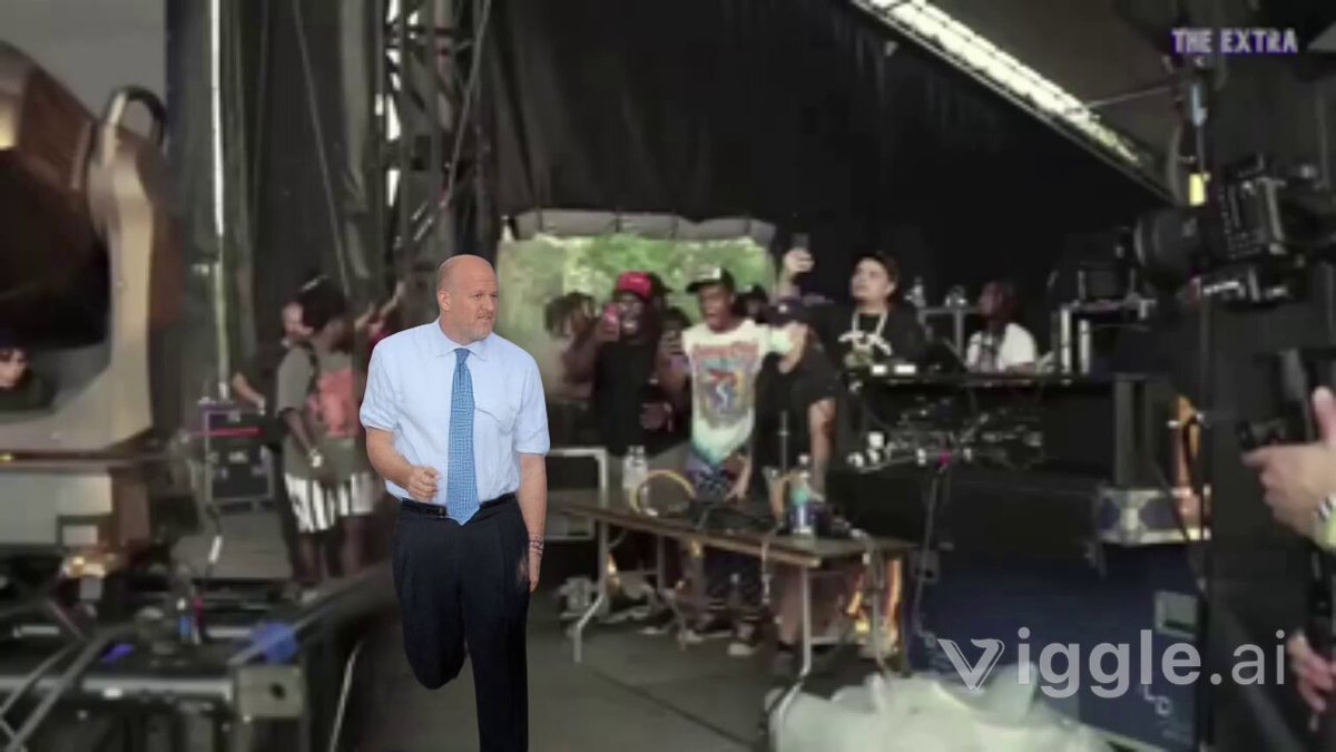 The image shows a man walking across a stage with a microphone, surrounded by people who appear to be filming him or taking photos of him. The caption reads "JIM CRAMER JUST SAID HE" which suggests that Jim Camper is the main subject in this scene. The phrase "THE BOTTOM IS IN." implies that there might have been an issue with Jim's equipment, possibly related to his microphone or camera.

The image also contains a reference to Bitcoin and a quote from someone named "JIM CRAMER". This could be a reference to the cryptocurrency market or a statement made by Jim Camper himself. The presence of these elements in the image adds context to the scene and helps convey the main subject's story more effectively.