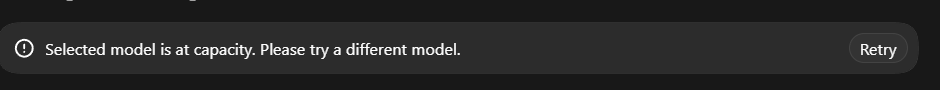 A dark error message box displays 'Selected model is at capacity. Please try a different model.' with a 'Retry' button.