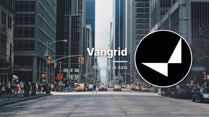 Promotional graphic for 'Vangrid Physical AI data' featuring a black and white geometric logo overlaid on a busy New York City street scene with yellow taxis.