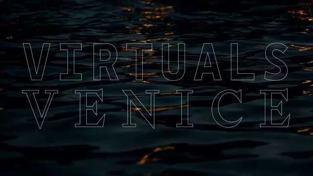 The image features a close-up of water, with the words "Virtuals Venice" written above it. The text is in white, which stands out against the dark blue background of the water. This suggests that the image might be related to an advertisement or promotional material for virtual reality experiences, such as those offered by the Venetian city of Venice.