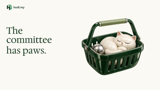 An advertisement for hadl.my features a white cat sleeping in a green basket next to the text 'The committee has paws.'