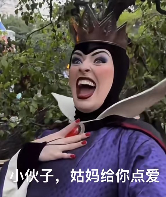 A person dressed as a Disney villain character with a spiked crown and purple costume laughs exaggeratedly with their mouth wide open, showing red-nailed hands pressed to their chest, with Chinese text reading "小伙子，姑妈给你点爱" (roughly "Young man, Auntie will give you some love") overlaid at the bottom. The image humorously represents the poster's reaction of admiration toward @Loopierr, accompanying their caption about dreaming of his captivating, handsome appearance after reviewing the GMGN competition livestream.