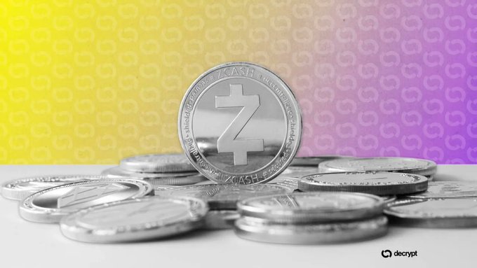 A stack of silver Zcash (ZEC) cryptocurrency coins with the Z logo displayed against a yellow and purple gradient background, branded with the decrypt logo.