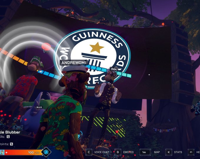A screenshot from a video game (Fortnite) showing animal characters dancing at an outdoor concert with a large "GUINNESS WORLD RECORDS" logo on stage.