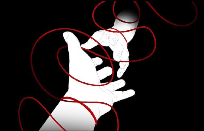 Two white illustrated hands reach toward each other against a black background, connected by a swirling red thread that loops and tangles around their fingers, visually embodying the "red thread of fate" that binds two destined souls together across any distance.