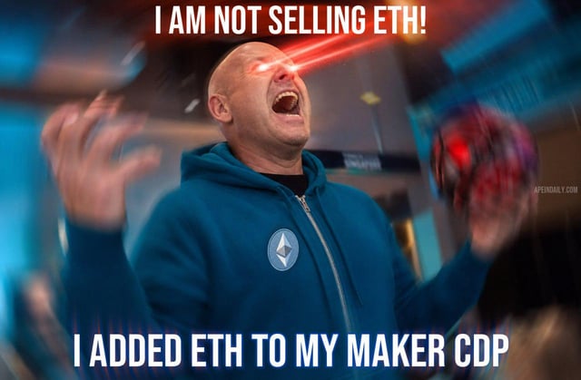 The image shows a man with blue eyes wearing goggles and a hoodie playing video games while holding a Nintendo Wii remote. There is an overlay text that appears to be a quote, stating "I am not selling eth!  I'm not selling ether either!" The man's reaction of excitement could be interpreted as him being excited about the game or surprised by something happening in the background.