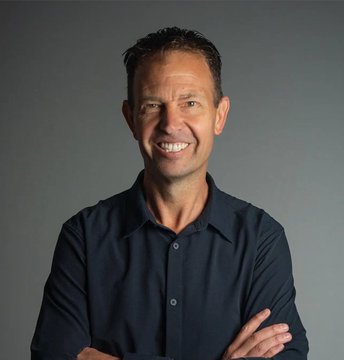 The image features a man with short hair wearing a black shirt, smiling at the camera while crossing his arms. The caption below the photo reads "JEFF BOOTH: Bitcoin might just be humanity's greatest invention", which seems to be related to the man in the picture and possibly the concept of Bitcoin.

This post is likely discussing the potential impact or significance of Bitcoin as a digital currency, given its association with Jeff Booth's statement about it being the "greatest invention". The image captures the attention of viewers by showcasing an individual who might be interested in or knowledgeable about this topic.