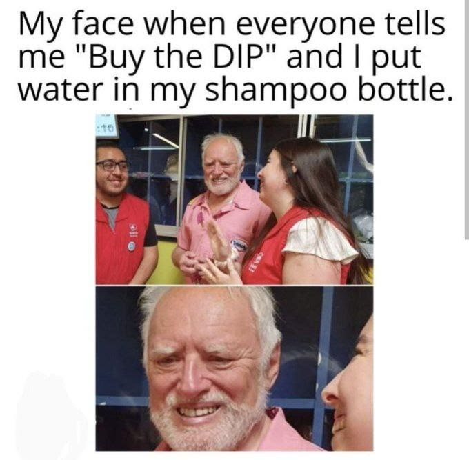 A meme with the caption "My face when everyone tells me 'Buy the DIP' and I put water in my shampoo bottle" is shown above two photos of an elderly man in a red shirt making a cringing, face-scrunching expression as a woman touches his face, humorously reflecting the post's skepticism about "buying the dip."