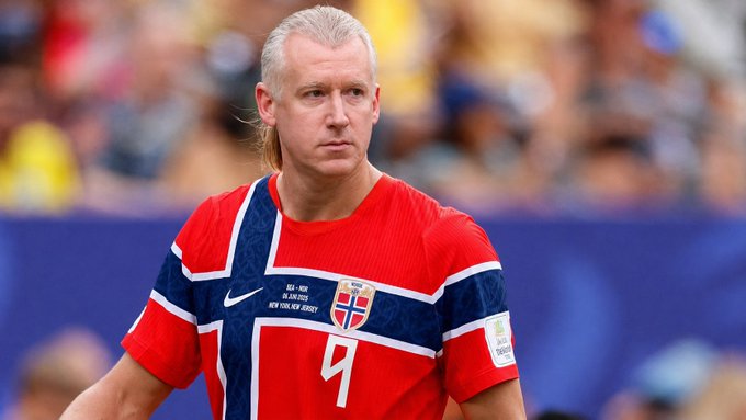 A Norwegian women's national team soccer player with blonde hair wearing the red jersey with number 4, featuring the Norway flag crest and match details for a USA vs Norway game.