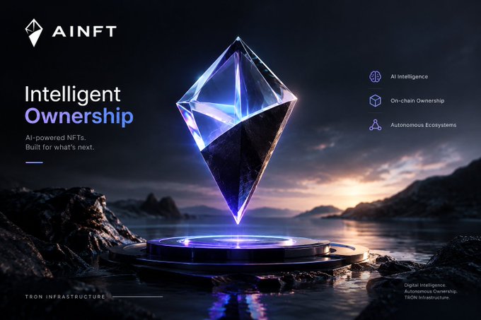 An advertisement for AINFT with the headline 'Intelligent Ownership' and tagline 'AI-powered NFTs. Built for what's next,' featuring a glowing blue crystal hovering above a platform with features 'AI Intelligence, On-chain Ownership, Autonomous Ecosystems' on the right.