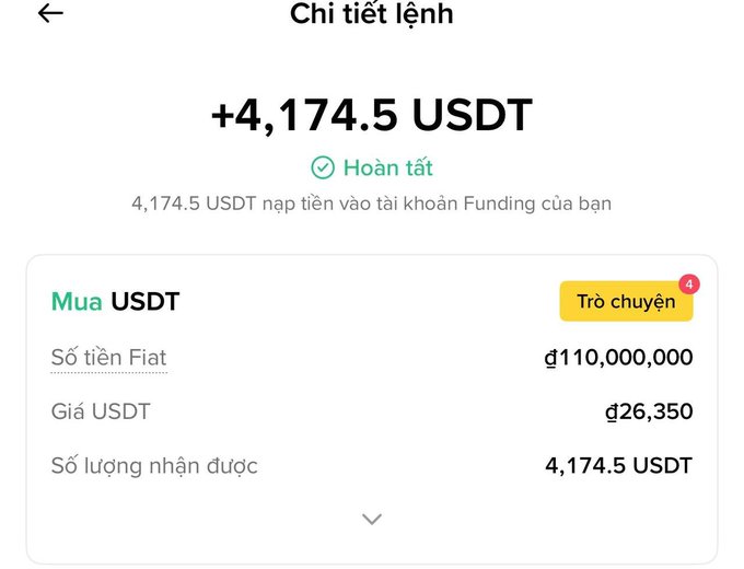 The image displays a screenshot of a text box that appears to be an excel spreadsheet or financial report. The content of this box includes information about currency conversion, specifically dollars and Thai baht. It's likely related to a payment transaction taking place in Thailand or an analysis of foreign exchange rates for an online business operating there. 
The post refers to the "nười ta cashout còn mình thì mua đều đặn USDT Chờ lên như là mít, toàn triệu tỉ giá này vẫn còn tỉ giá này như in tiền như là mít.