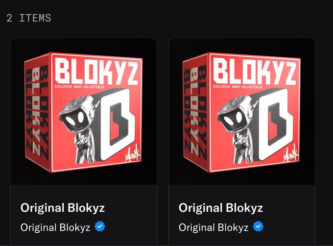 Two identical red boxes labeled 'BLOKYZ EXCLUSIVE WEB3 COLLECTIBLES' with a black blocky character and 'Original Blokyz' text appear in a digital inventory showing '2 ITEMS'.