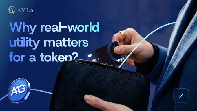 A QAYLA promotional graphic titled 'Why real-world utility matters for a token?' showing a hand placing a Visa card into a wallet, with A1G branding visible.
