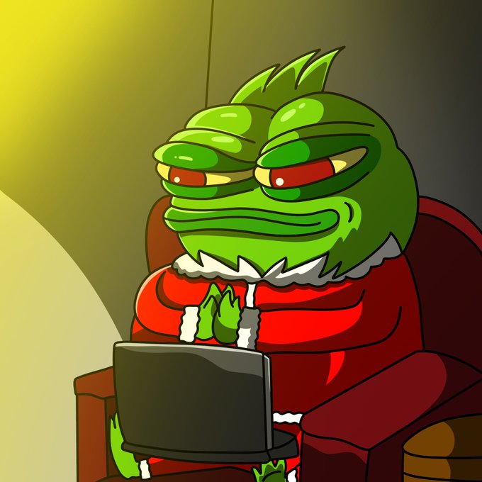 The image features a cartoon frog sitting inside an armchair with its legs crossed while using a laptop computer. The frog appears to be wearing a red suit and has a green face, giving it a unique and amusing appearance. The scene takes place indoors, possibly in front of a window or other source of natural light that illuminates the room.