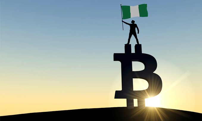 A silhouette of a person holding the Nigerian flag stands atop a Bitcoin "B" symbol against a sunrise backdrop, symbolizing Nigeria's emergence into cryptocurrency regulation. The image visually represents the post's news about the Nigerian President signing an executive order to establish a Virtual Asset Commission.