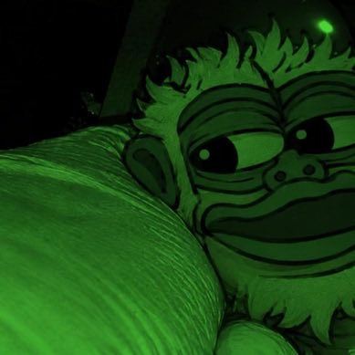 A dark, green-tinted stylized illustration of an elderly bearded character with a sad or weary expression, shown in a close-up portrait.