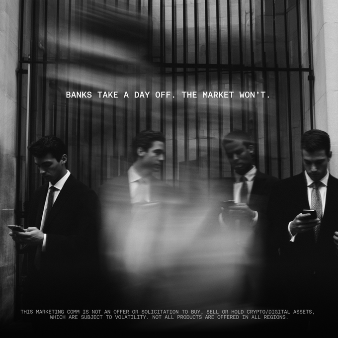 Four businessmen in suits stand absorbed in their phones in front of a gated building, with the headline "BANKS TAKE A DAY OFF. THE MARKET WON'T." displayed prominently above them and a disclaimer about crypto/digital asset volatility below.

The image visually reinforces the post's message by depicting distracted professionals (representing traditional banking limitations) while promoting OKX's 24/7 tokenized stock and ETF trading as an alternative that operates continuously unlike conventional markets.