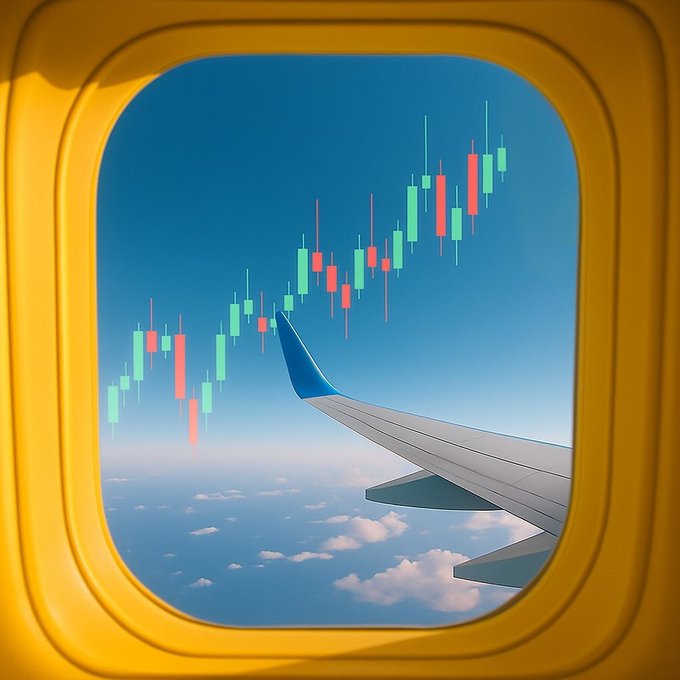 A creative composite image showing an airplane wing viewed through an airplane window, with the sky replaced by a green and red candlestick trading chart depicting an upward price trend.