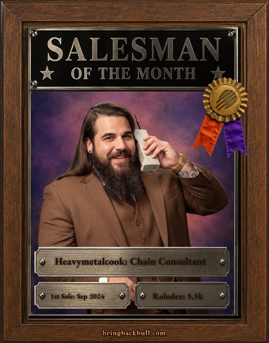 The image is a "Salesman of the Month" award plaque featuring "Heavymetalcook: Chain Consultant," with a "1st Sale: Sep 2024" and "Rolodex: 5.5k," showing a long-haired, bearded man in a brown suit smiling while talking on a vintage telephone. This relates to the post by promoting Heavymetalcook as a knowledgeable Solana/Liquidity Provider specialist offering consultation services through the Meteora AG LP Army.
