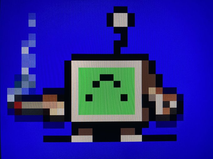 Pixel art of a green character with a sad face on a screen, with pixelated smoke rising against a blue background.