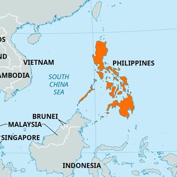 The image is a map of Southeast Asia highlighting the Philippines in orange, labeling surrounding countries (Vietnam, Cambodia, Brunei, Malaysia, Singapore, Indonesia) and the South China Sea, visually pinpointing the nation where new crypto license approvals have been frozen for 12 months.