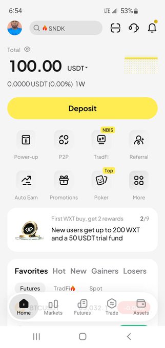 A cryptocurrency app showing a USDT account balance of 100.00 with various features like Power-up, P2P, TradFi, and a promotion for new users offering up to 200 WXT and 50 USDT.