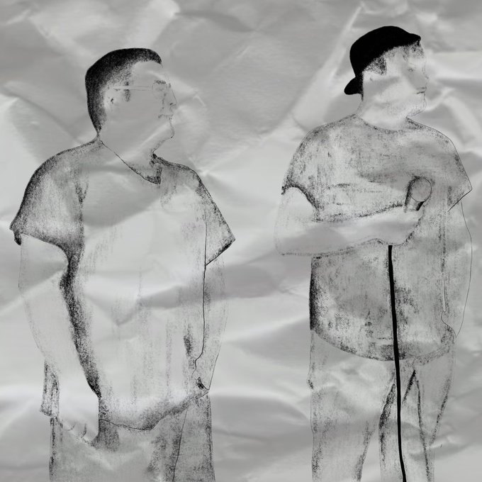 A black-and-white stylized image of two men standing against a crumpled paper background, with one wearing glasses and a t-shirt and the other wearing a backward cap and holding a cane.