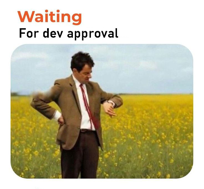 A man in a brown suit and red tie stands in a yellow field checking his watch, illustrating the "Waiting For dev approval" text, which humorously conveys the anticipation and impatience users feel while waiting for the checker to go live as mentioned in the post.