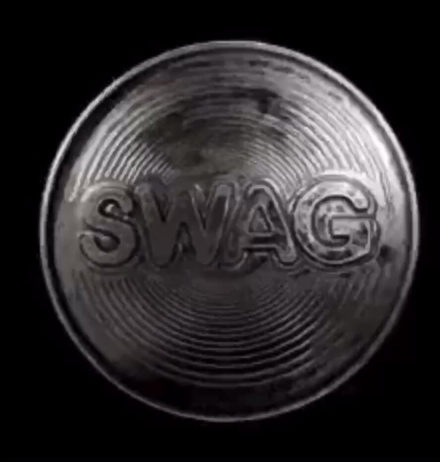 The image features a silver coin with the word "swag" written on it. The coin has a spiral design around its edge, giving it an interesting visual appeal. The background of the image is black, which contrasts nicely with the silver color of the coin and makes it stand out even more. The caption below the coin reads: "Its ridiculous to bull post memes in these conditions luckily swag coin is no such thing it was the key to little swag world, to drifella, to card nft it is a timeless sacred asset, the pursuit of which is every swag knight's purpose swag is eternal". This caption provides context about the significance and history behind the coin.