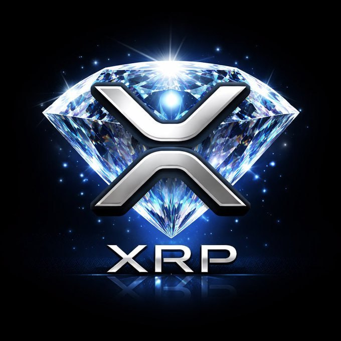 The image features a logo of a diamond-shaped emblem with the letter "X" written inside. The background appears to be black, with bright lights shining on it. In front of this design, there's a text that reads: "If they want my XRP, they should pay $10, not $1". This suggests a connection between the logo and the Bitcoin currency or crypto-market investing theme.