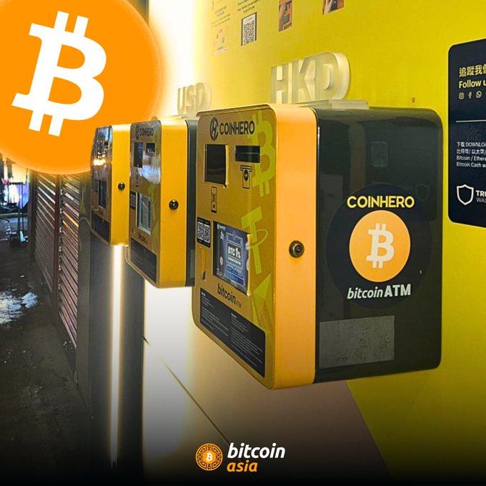 The image features three yellow coin-operated machines labeled "CoinHero" and "BITTIN'H" along with a Bitcoin symbol. The text at the bottom of the image reads, "Fun fact: Hong Kong has 236 #Bitcoin ATMs". This fun fact is related to the post about Bitcoin ATMs in Hong Kong, as it highlights that there are multiple Bitcoin ATMs available for use in the city.
