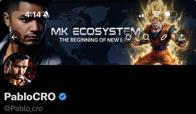 The image features a man with a beard, wearing a black jacket, standing against a dark background. He has a large screen behind him that displays an advertisement for a new ecosystem game called MK Ecosystem. The advertisement includes a picture of a character from the game and text promoting the game's features.